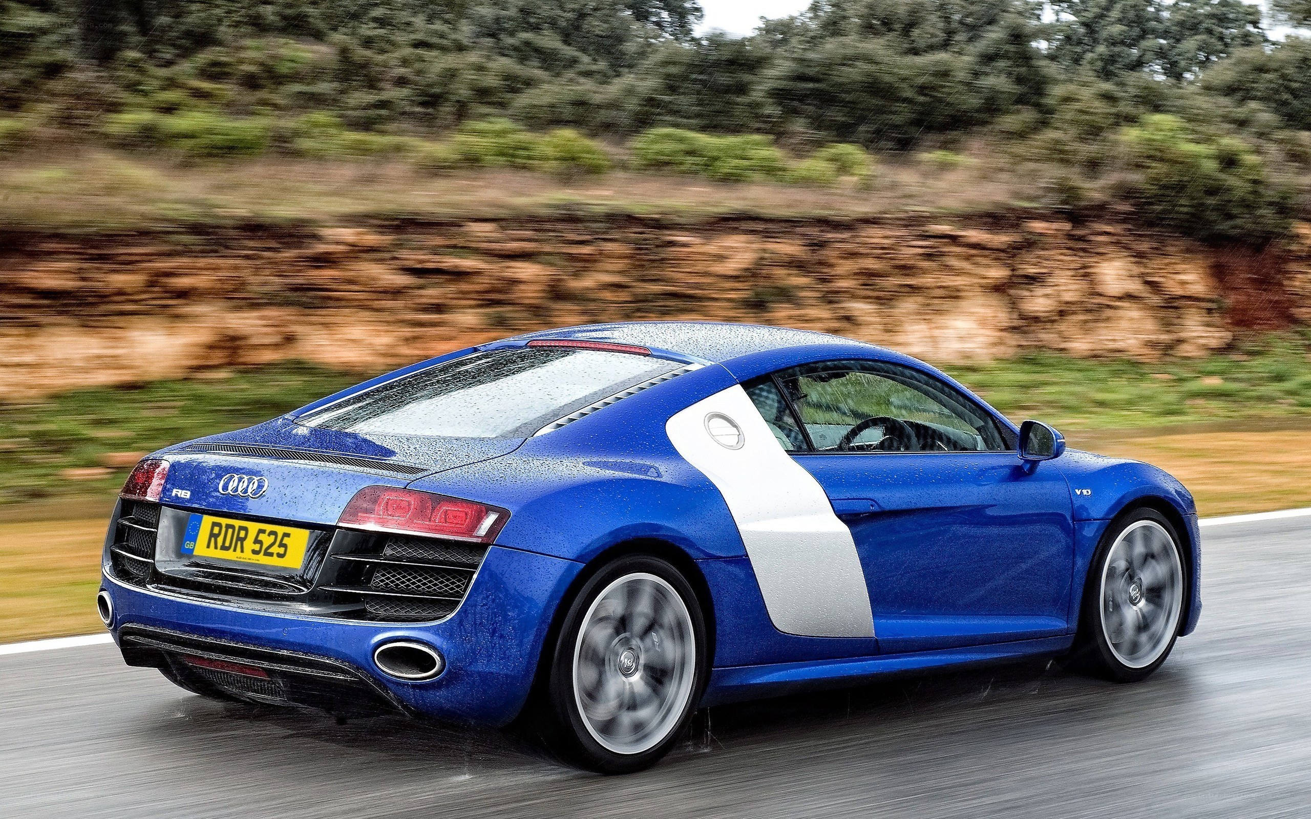 blue audi r8 in motion