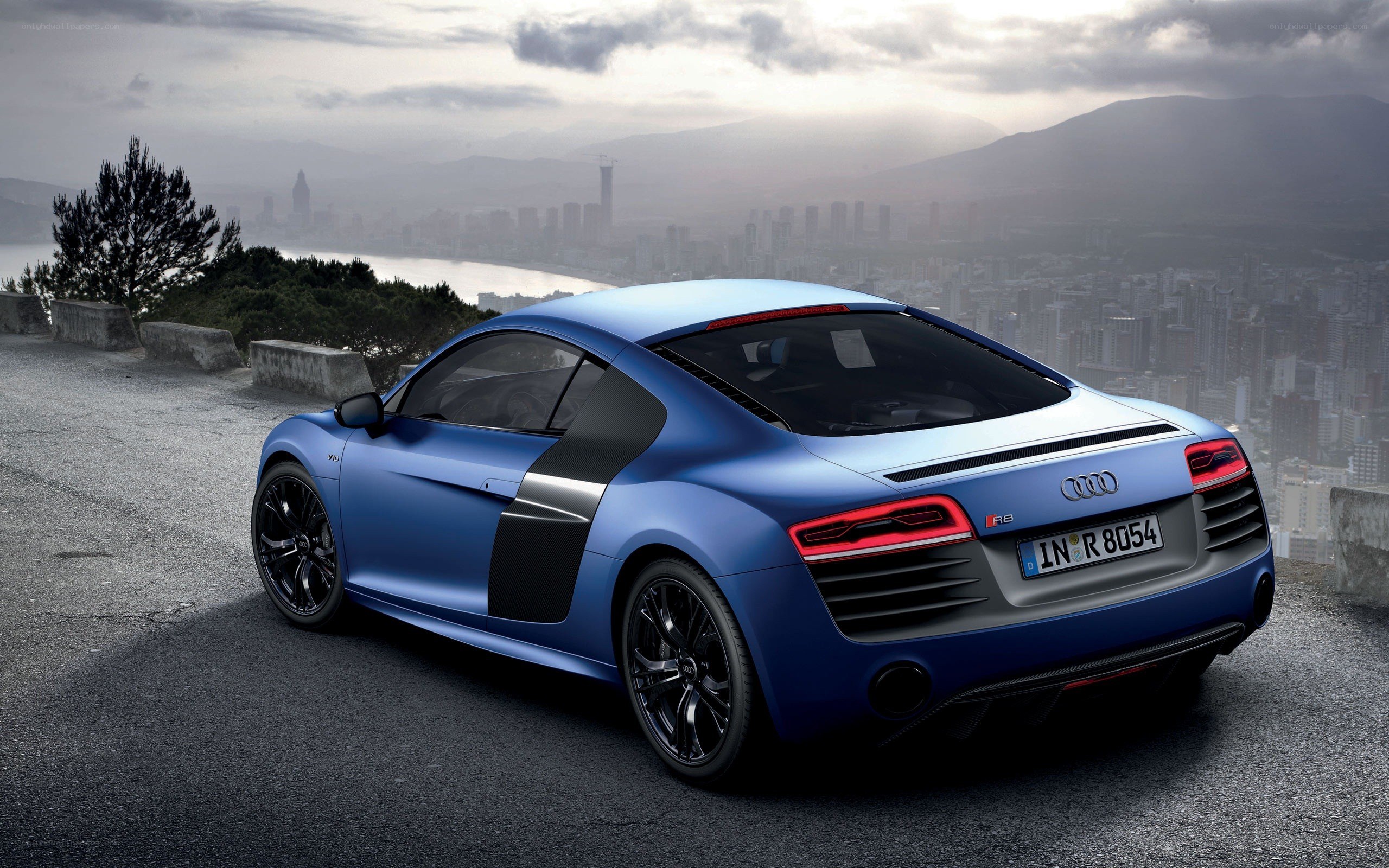 Blue Audi R8 on a cliffside