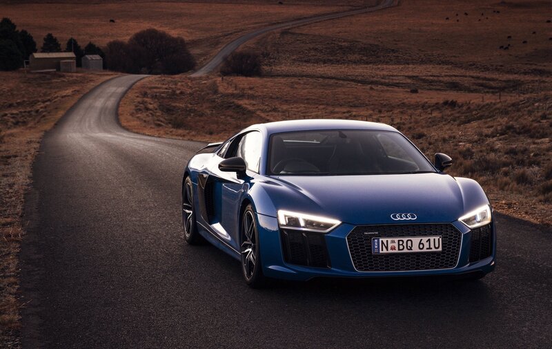Blue Audi R8 on a country road
