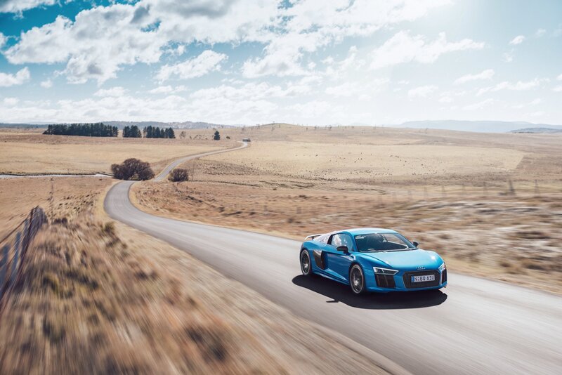 Blue Audi R8 on a country road