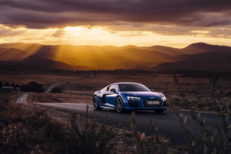 Blue Audi R8 on a country road