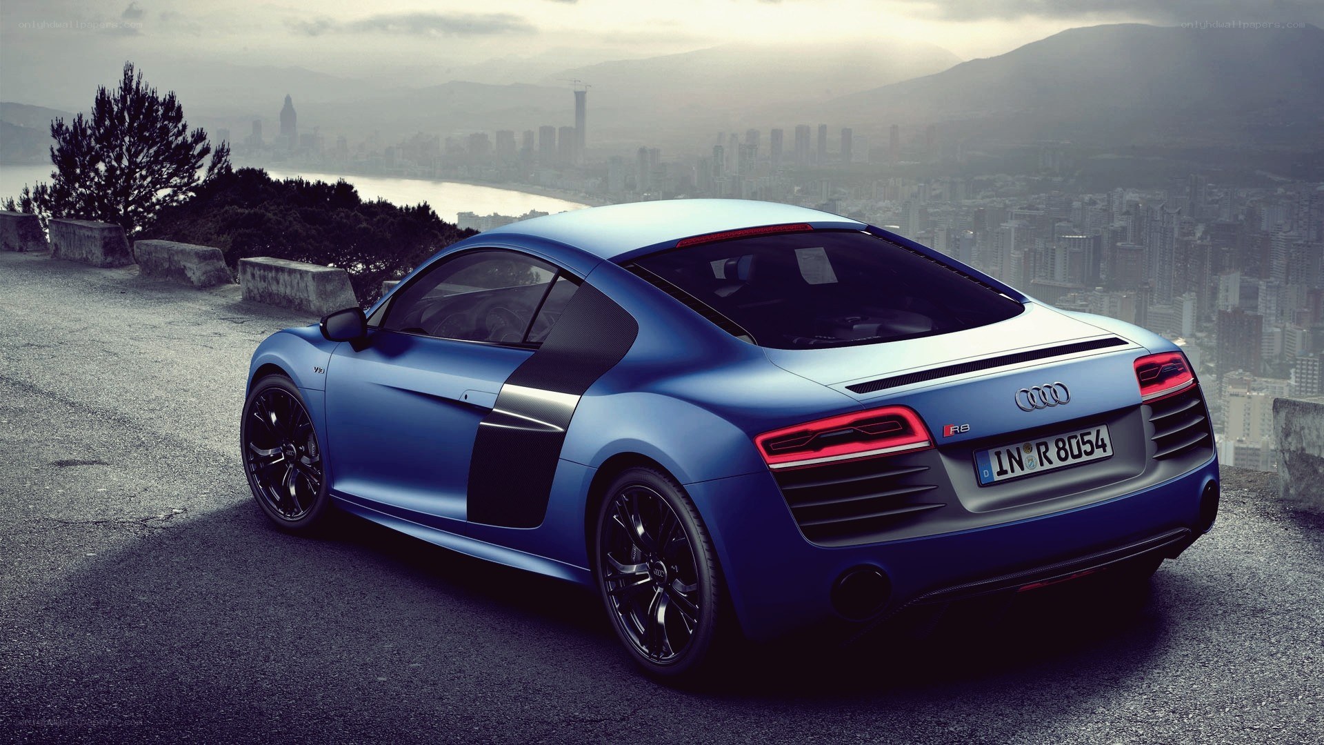 Blue Audi R8 on a hilltop