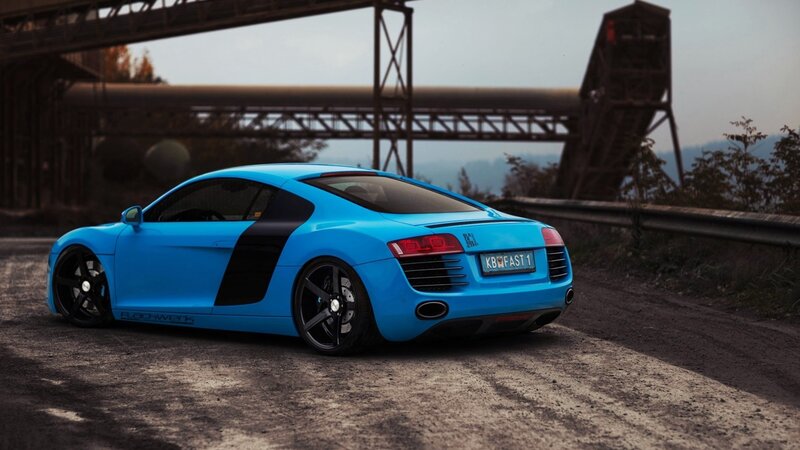 blue audi r8 on a road