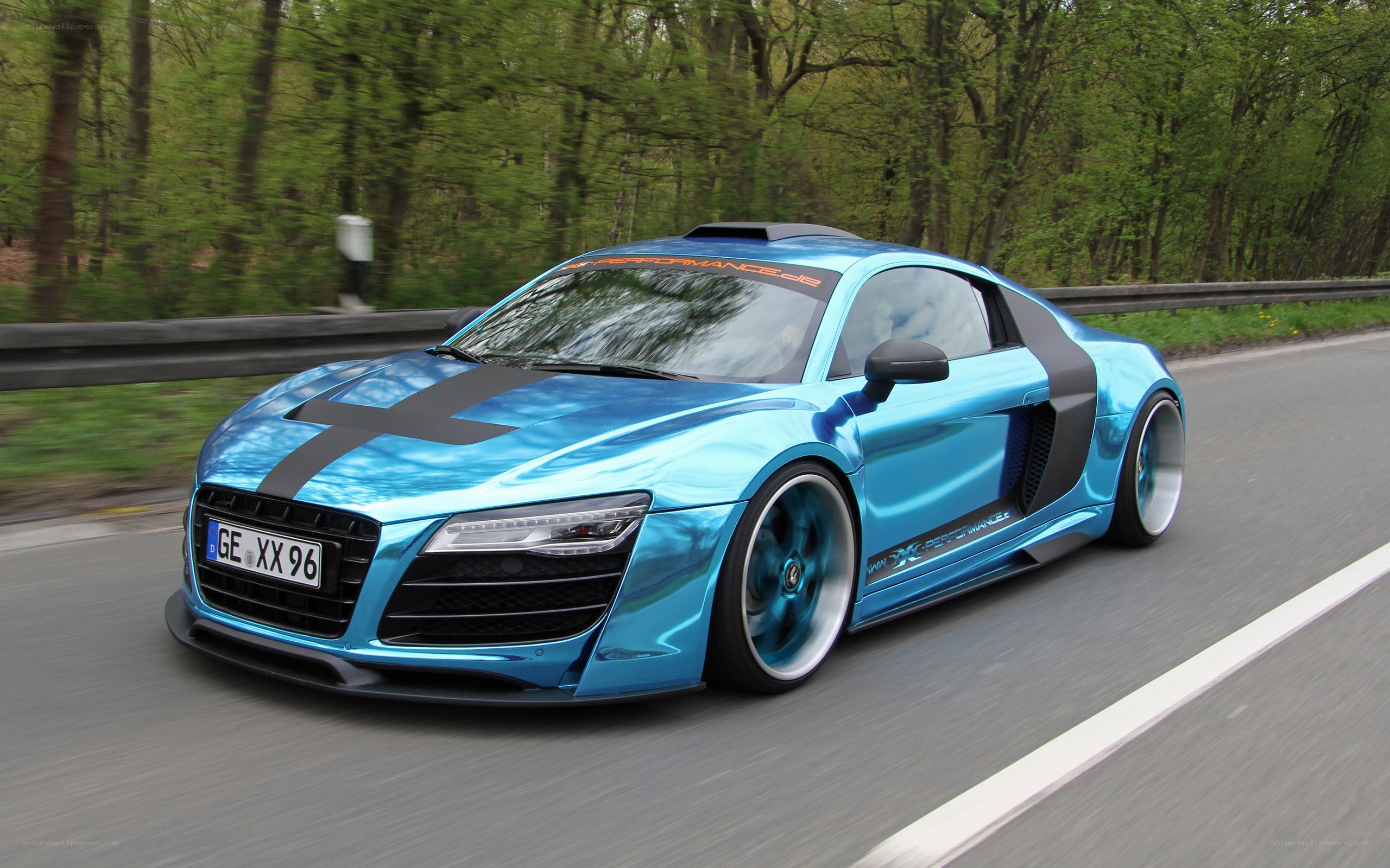blue audi r8 on a road