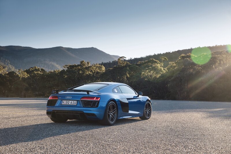 Blue Audi R8 on a scenic road