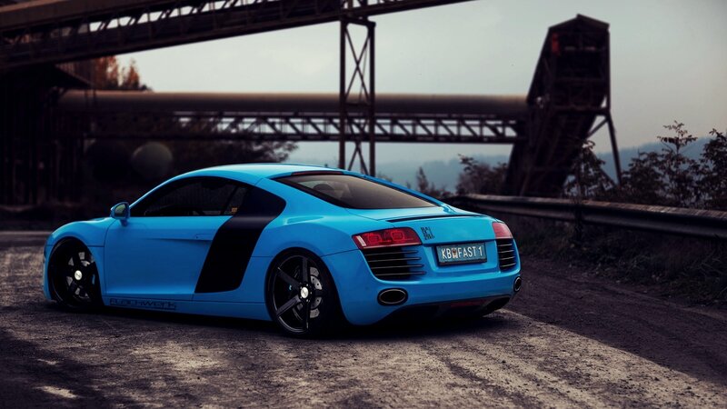 blue audi r8 on industrial road