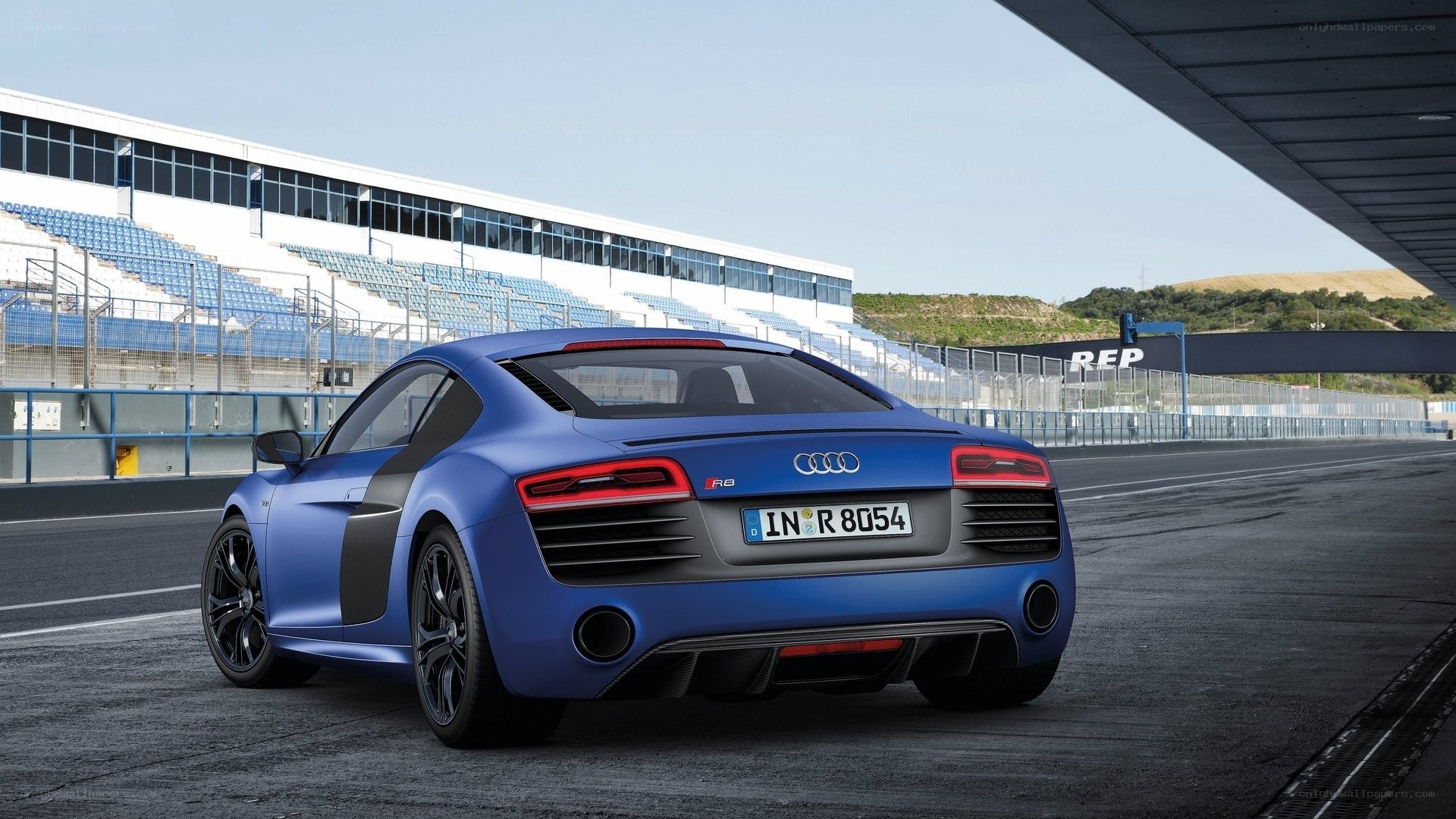 Blue Audi R8 on racetrack