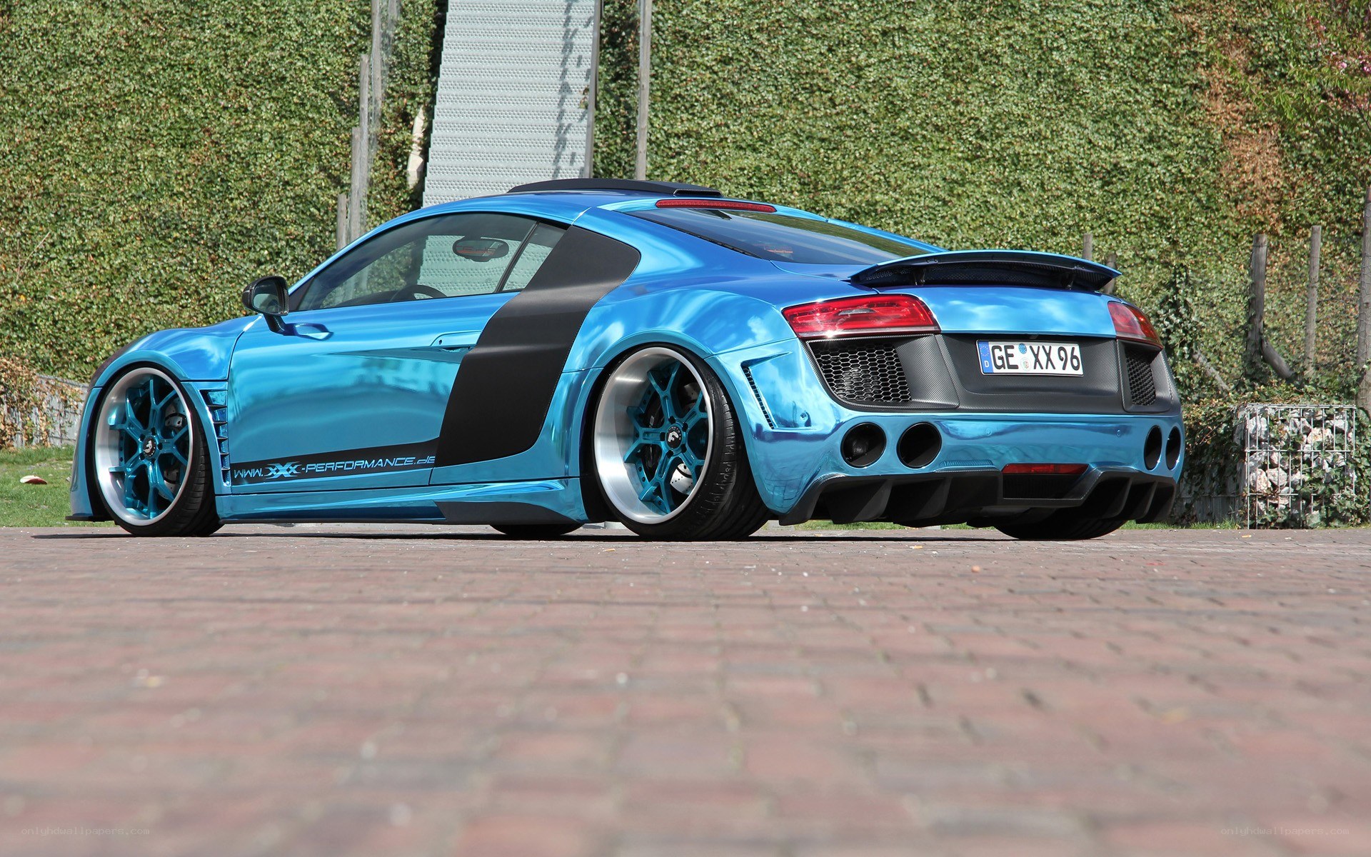 blue audi r8 with custom wheels