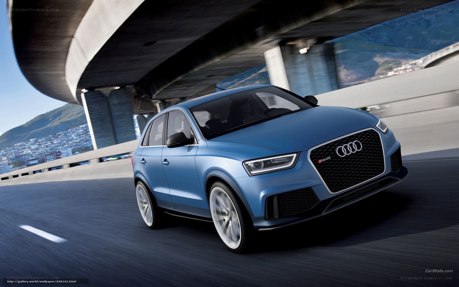 Blue Audi RS Q3 on a highway