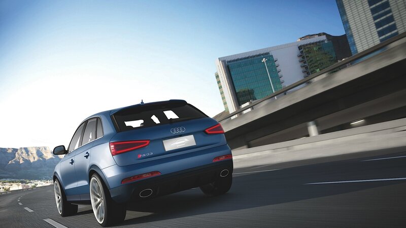 Blue Audi RS Q3 on city road