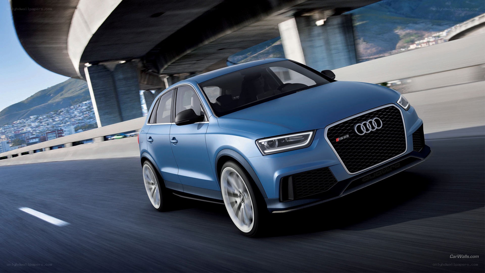 Blue Audi RS Q3 on highway