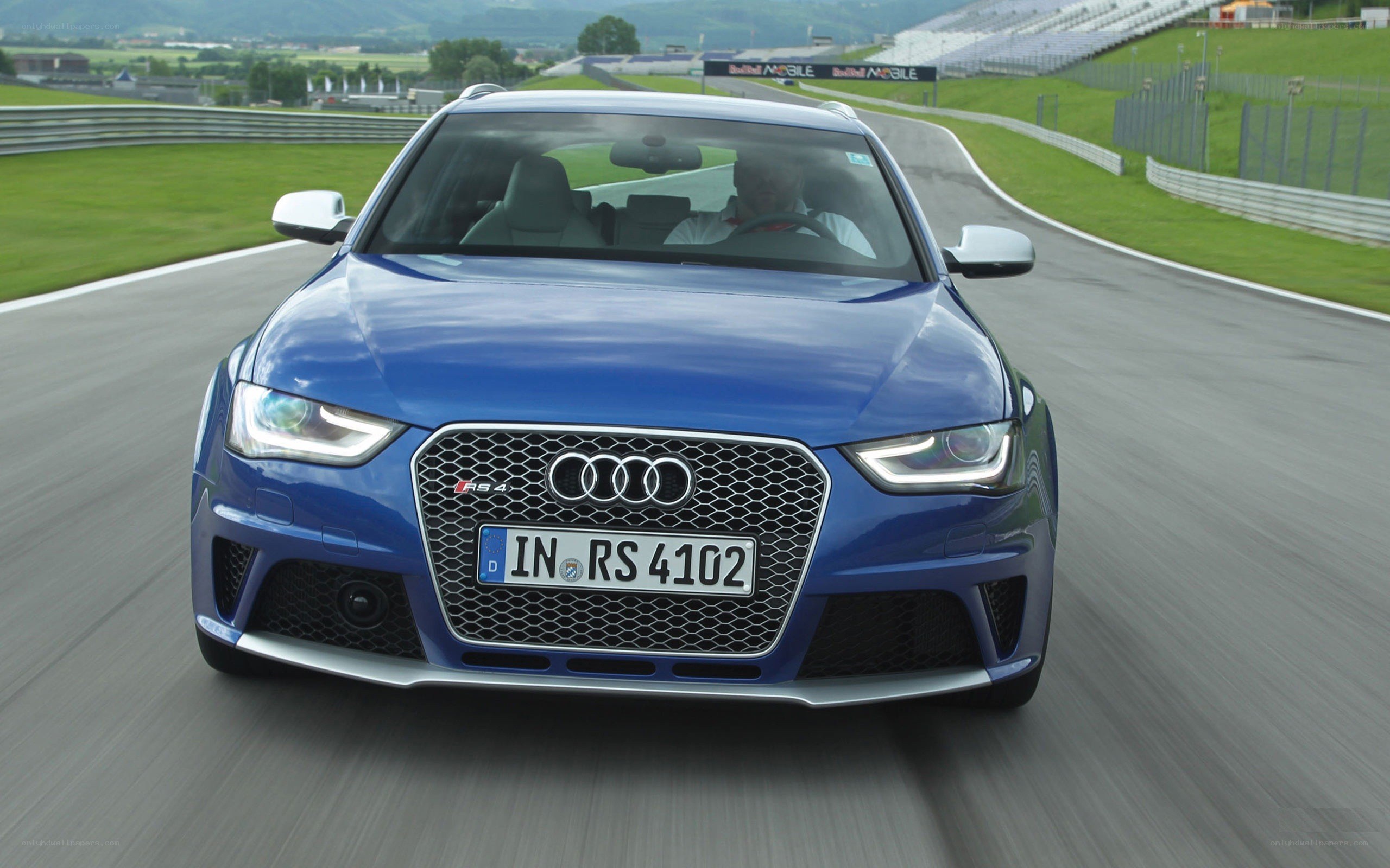 Blue Audi RS4 on a racetrack