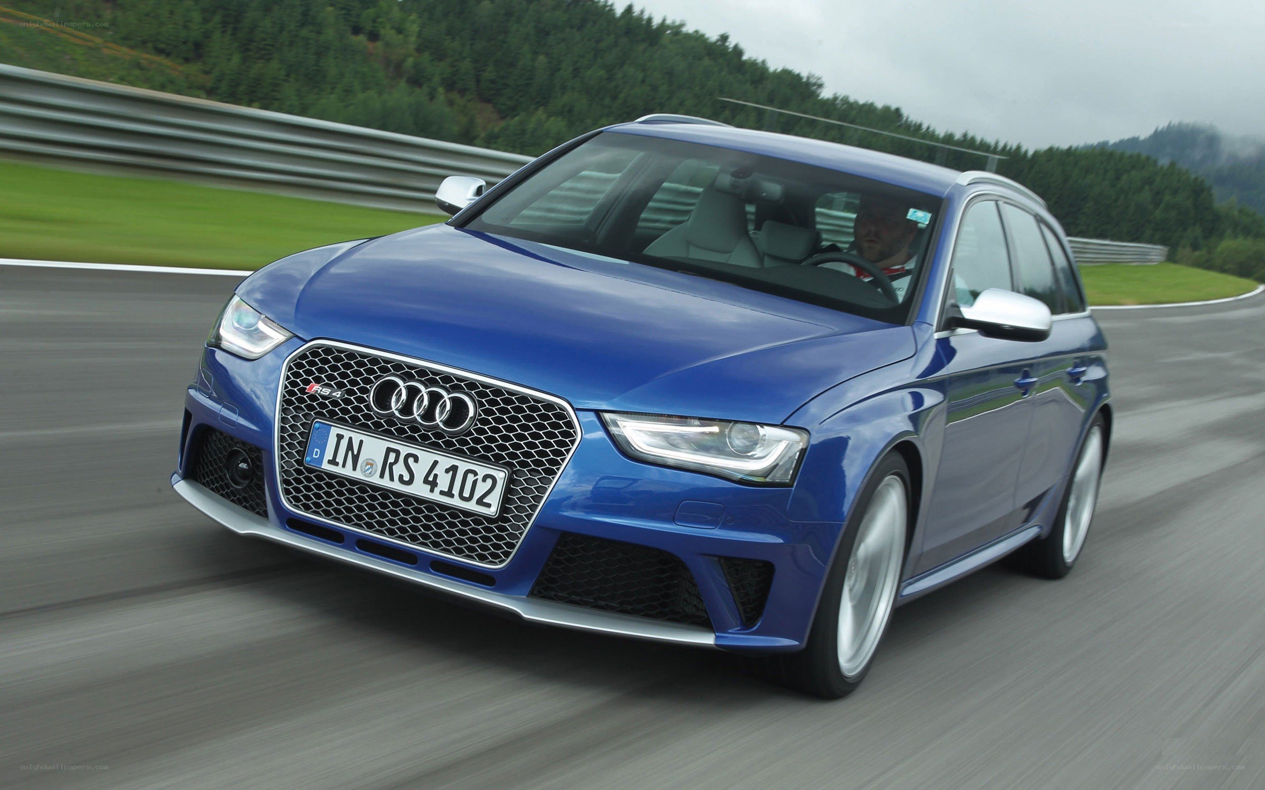 Blue Audi RS4 on a racetrack