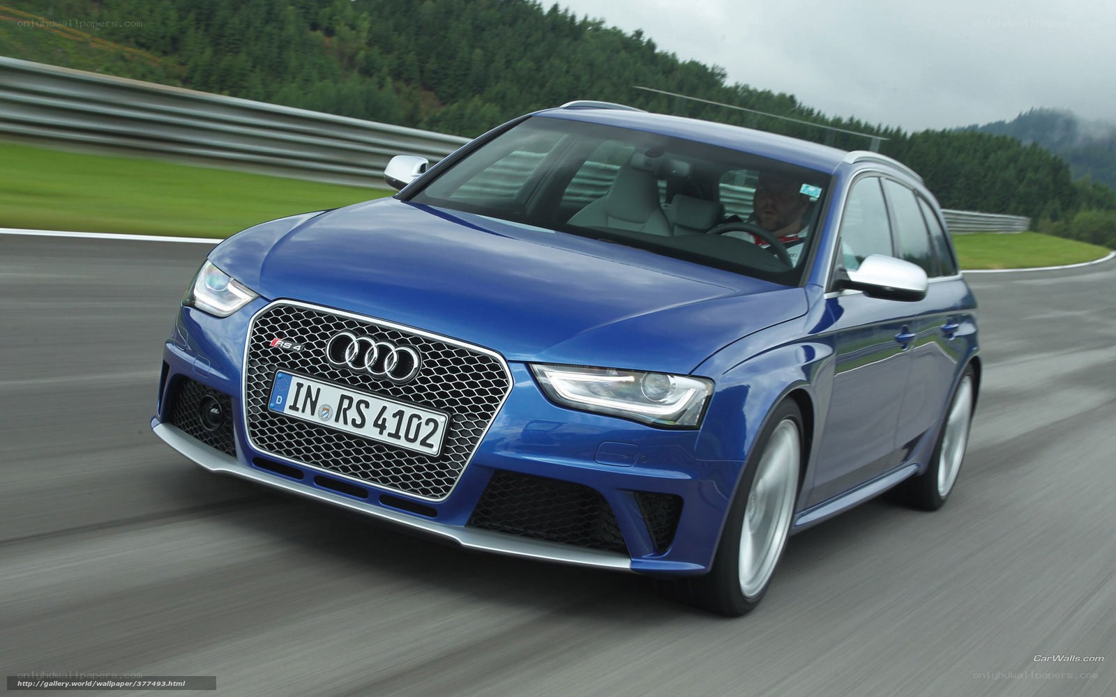 Blue Audi RS4 on a racetrack