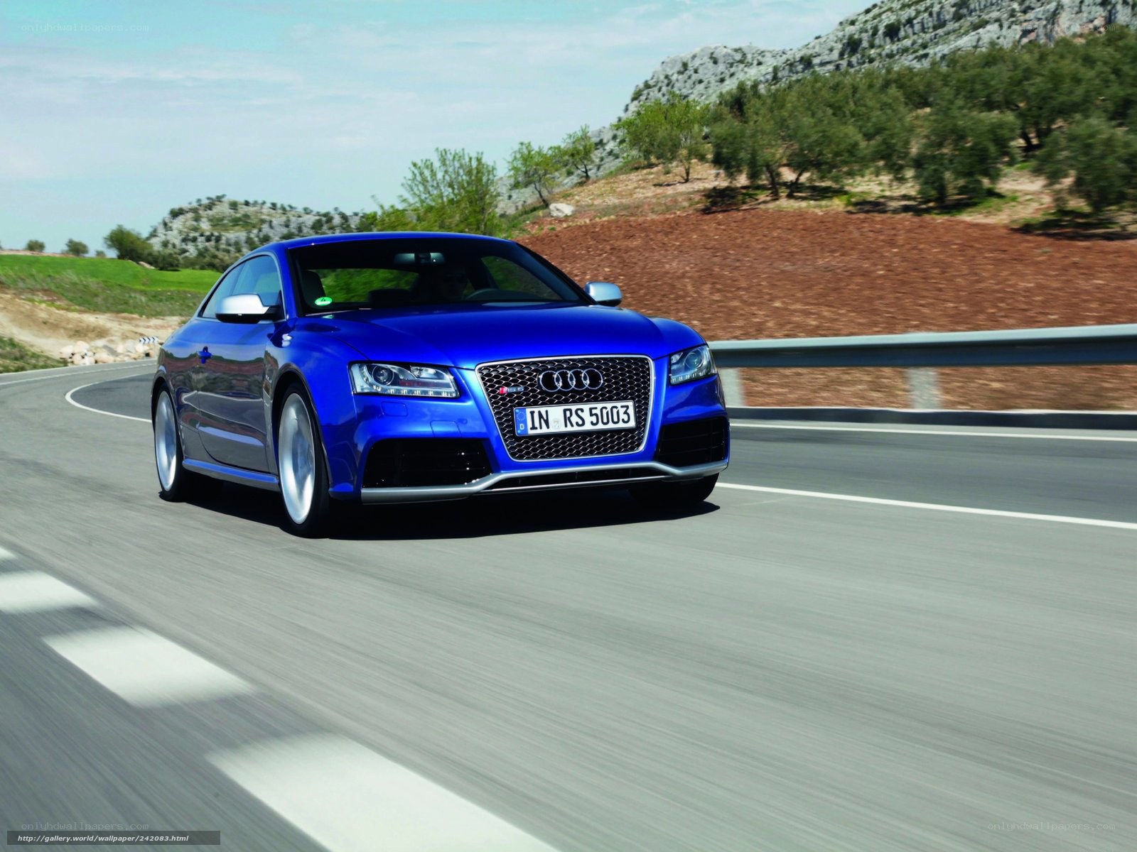 Blue Audi RS5 on a winding road