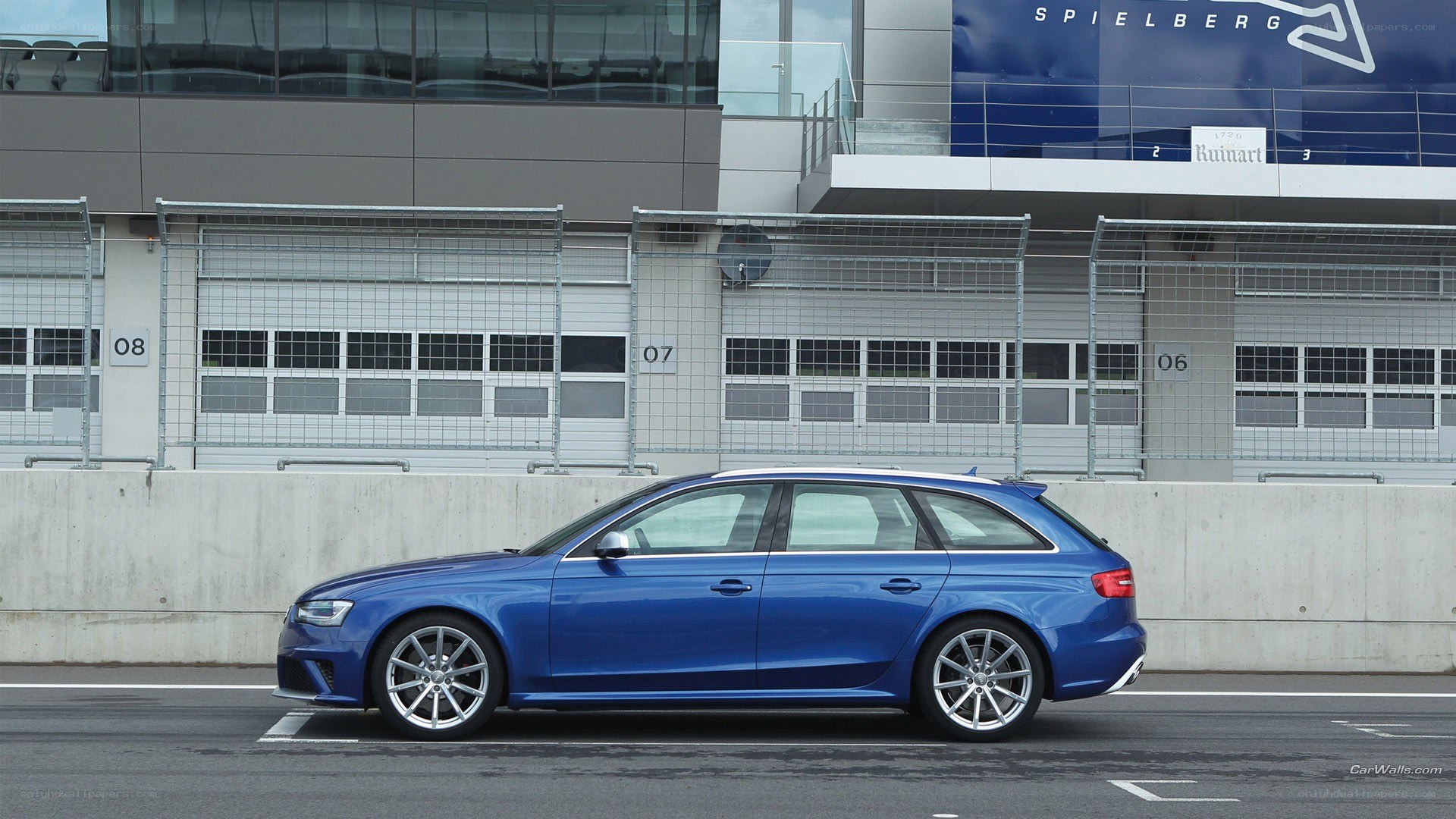 Blue Audi RS6 at a racetrack