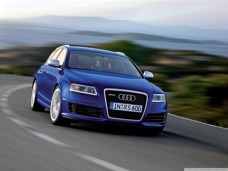 Blue Audi RS6 on a coastal road