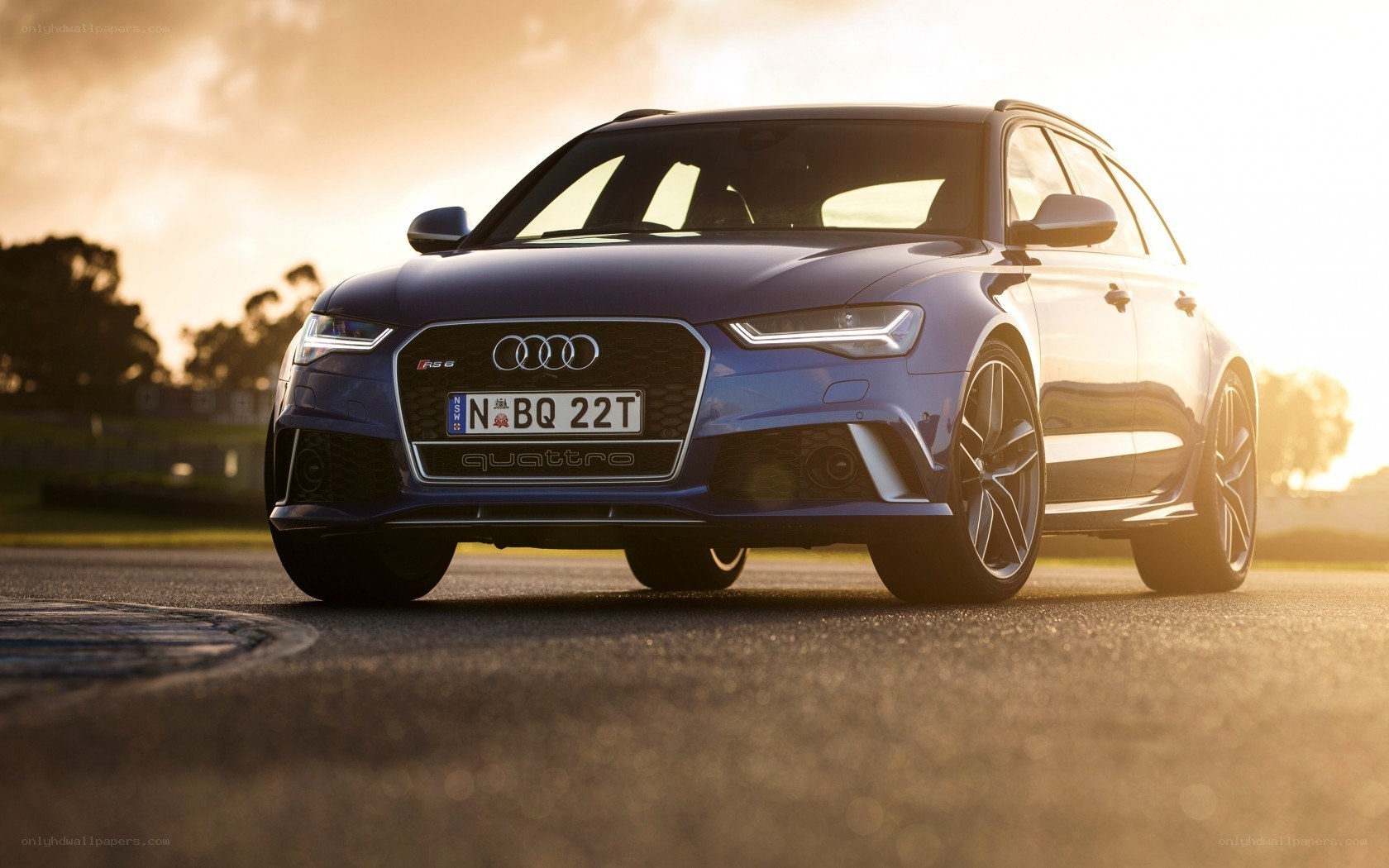 Blue Audi RS6 on a track