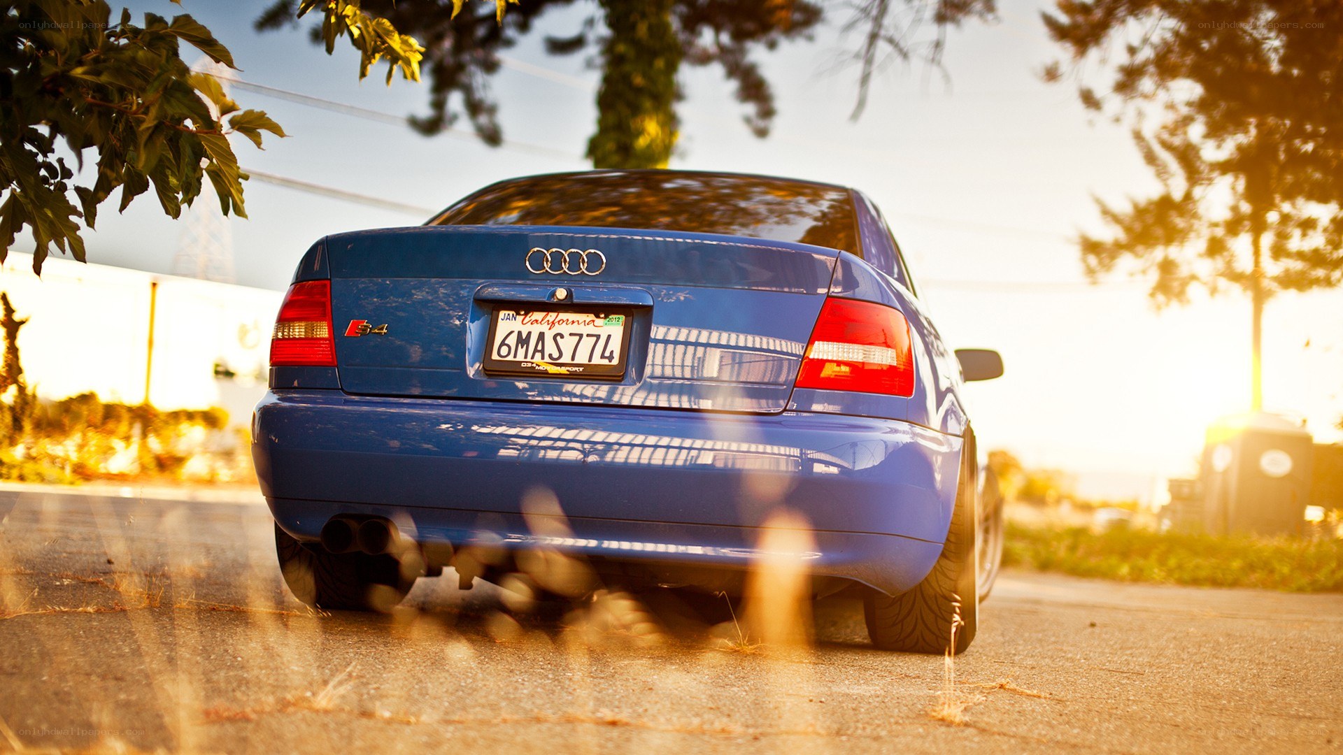 blue audi s4 at sunset