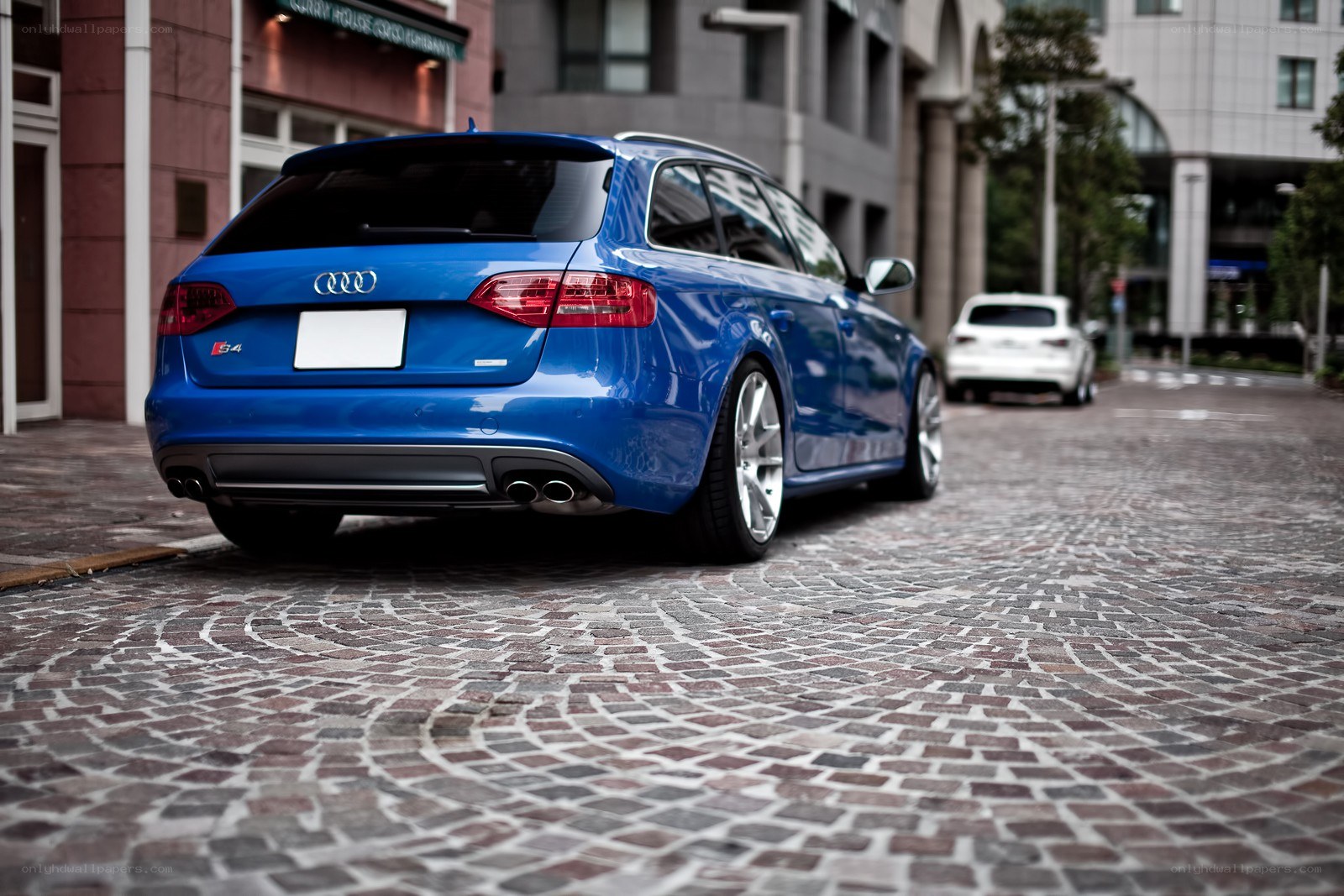 blue audi s4 on cobblestones
