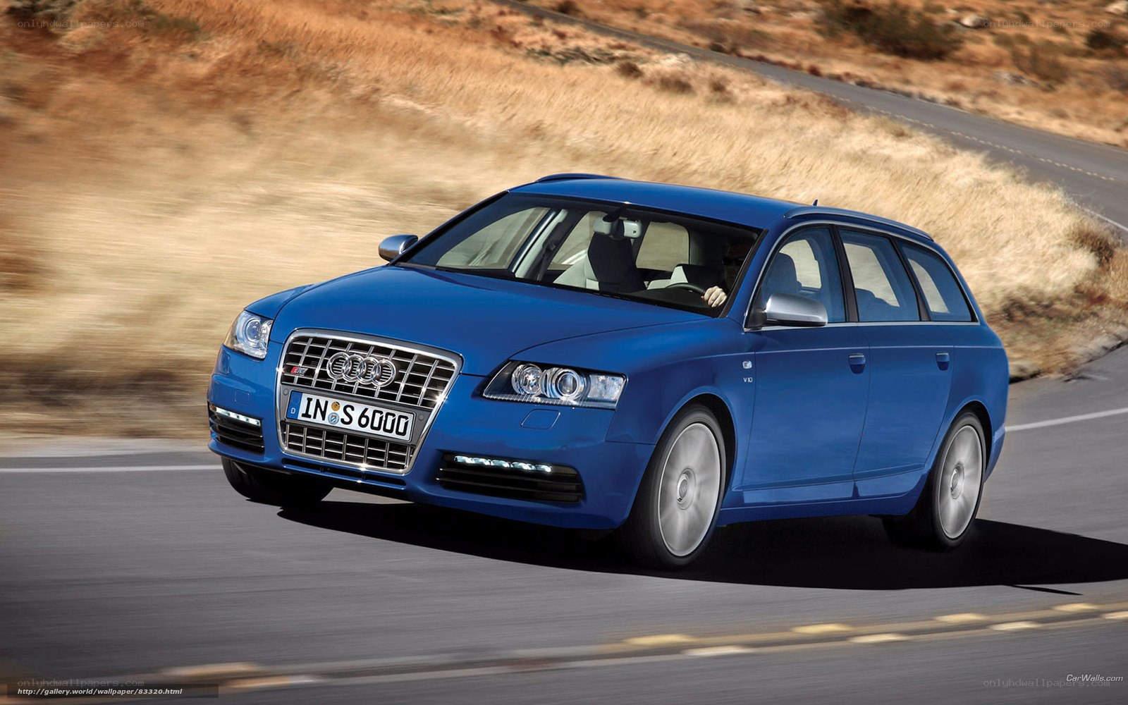 Blue Audi S6 Avant in motion