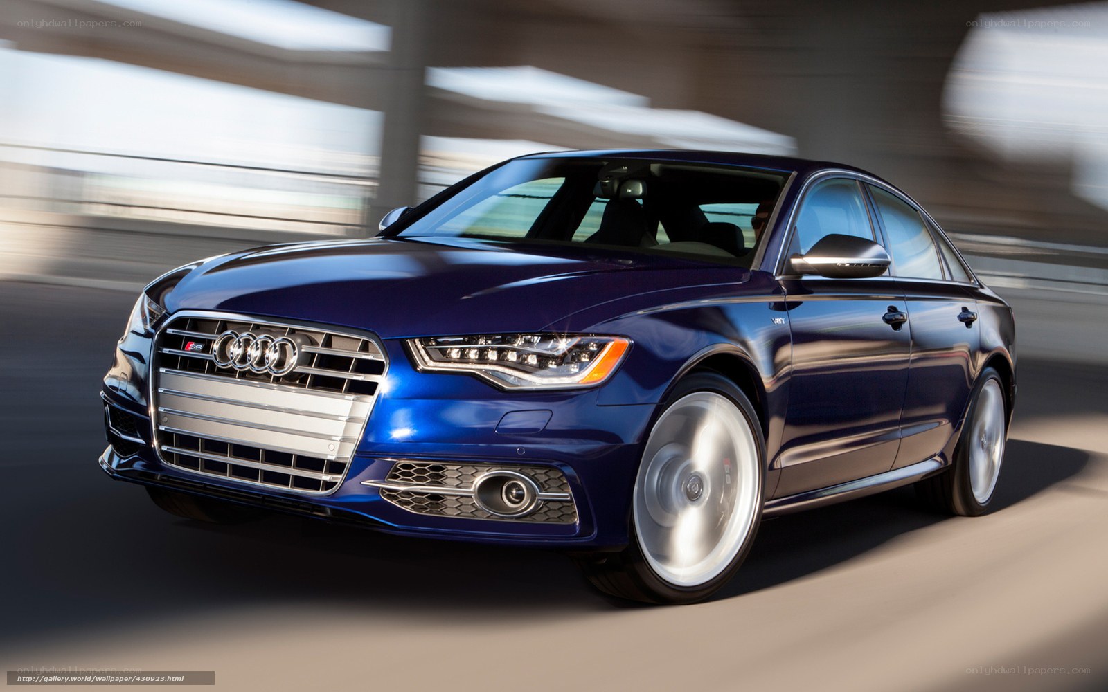 Blue Audi S6 in motion