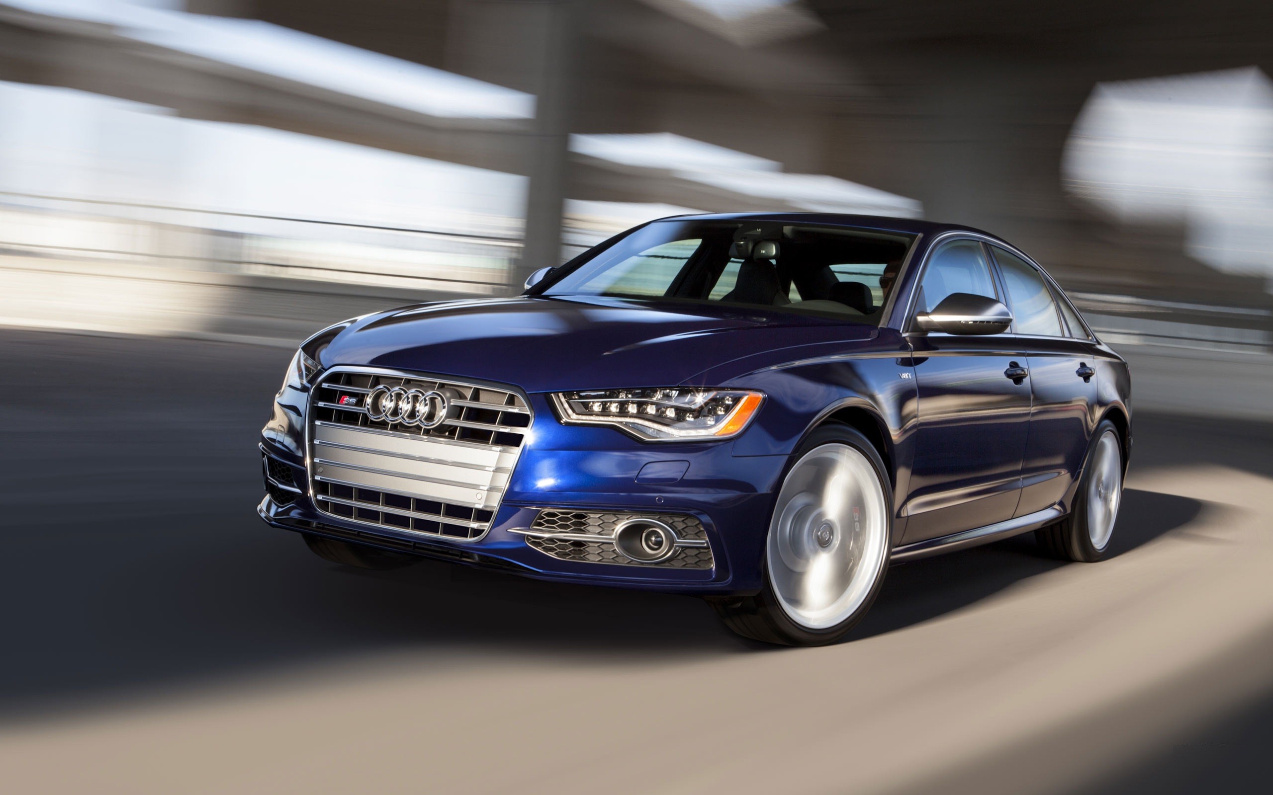 blue audi s6 in motion