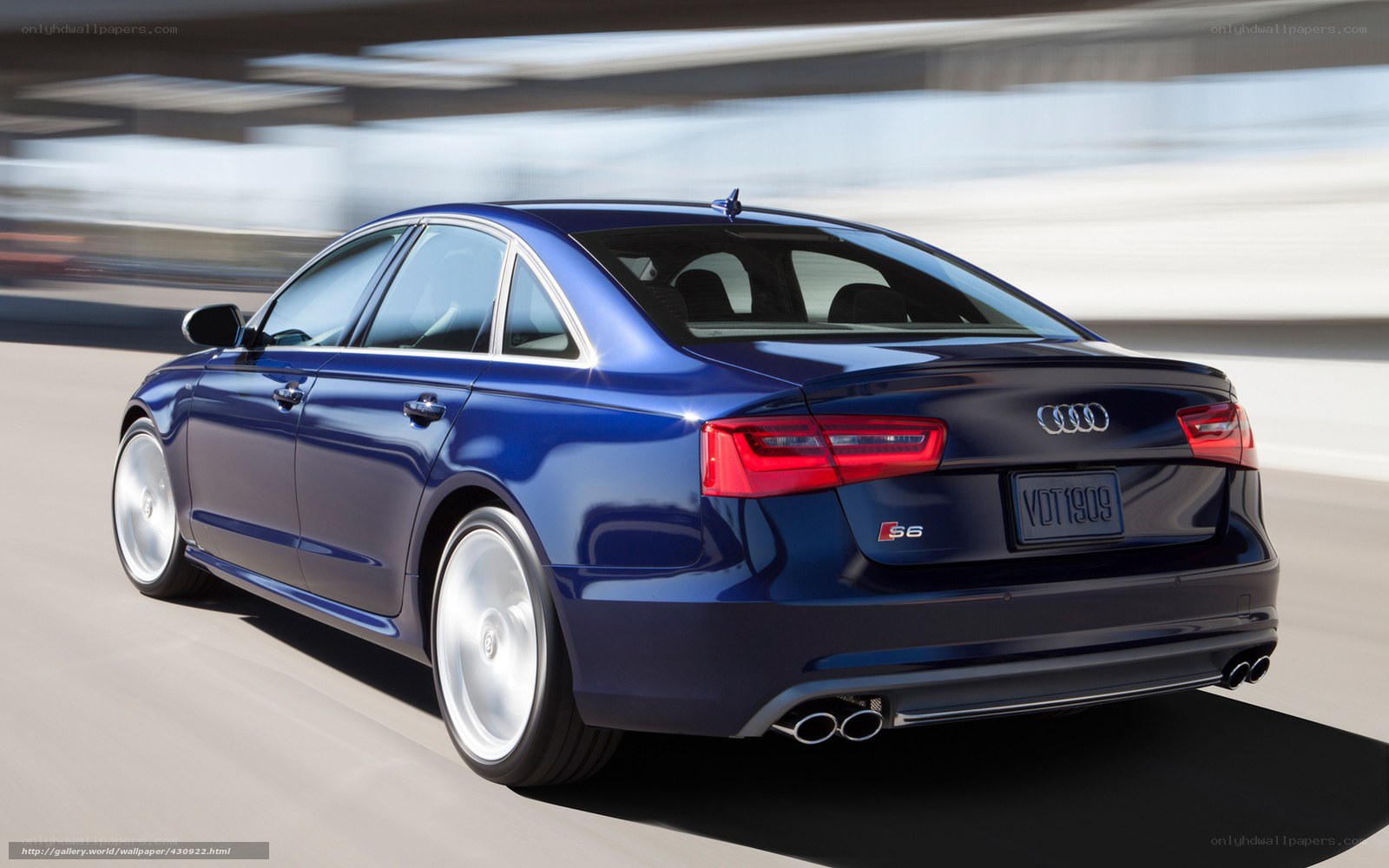 Blue Audi S6 in motion