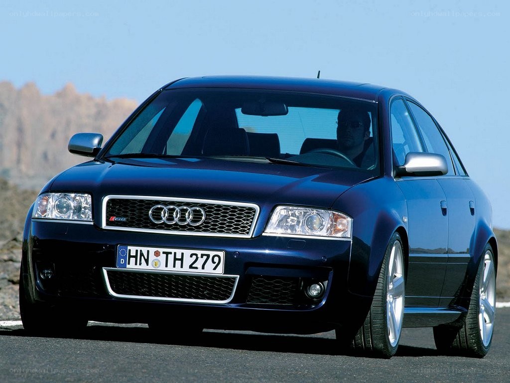 blue audi s6 on road