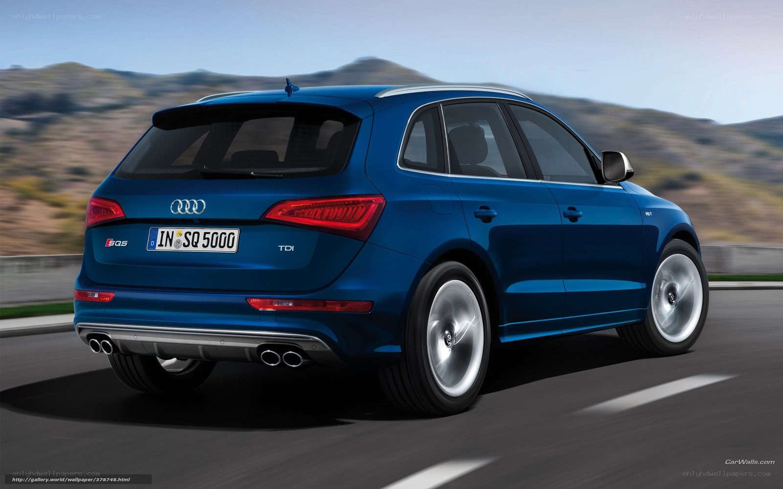 blue audi sq5 driving on road
