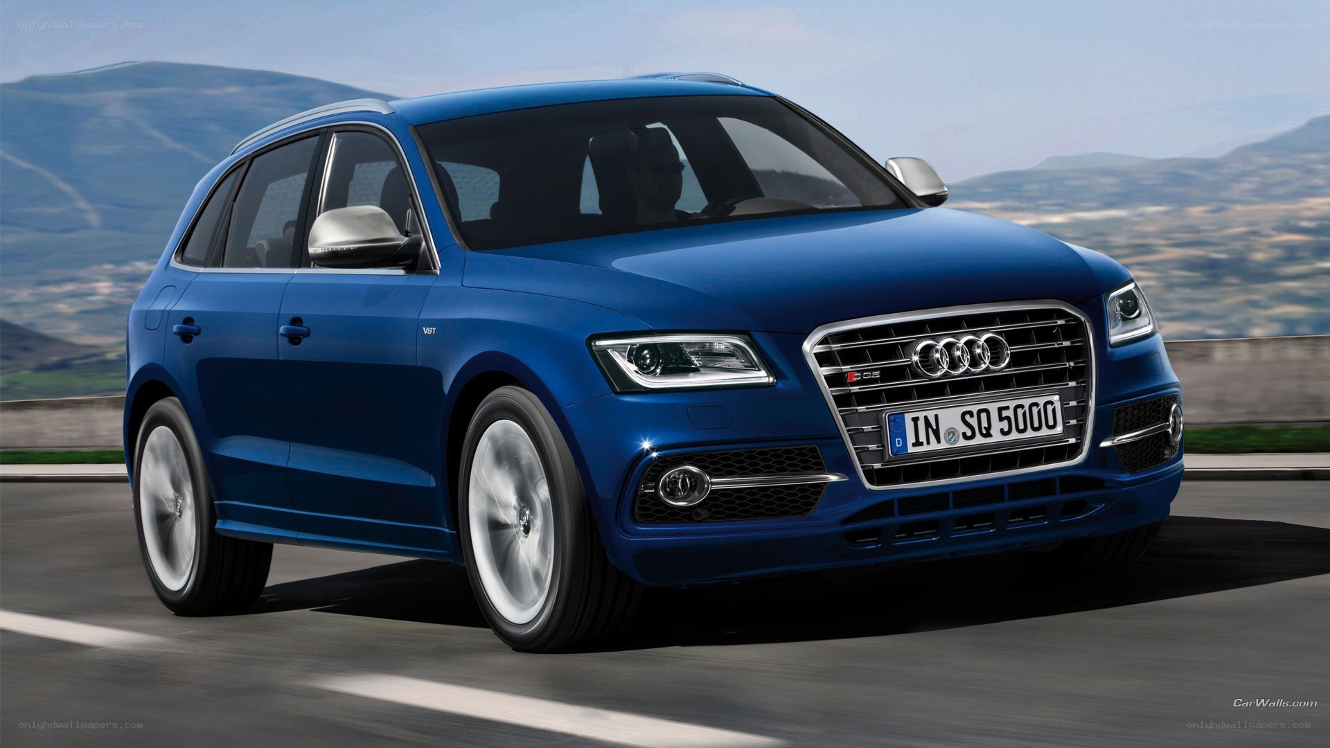 blue audi sq5 on road