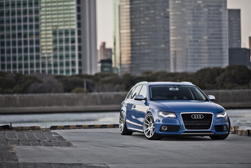 Blue Audi station wagon in city