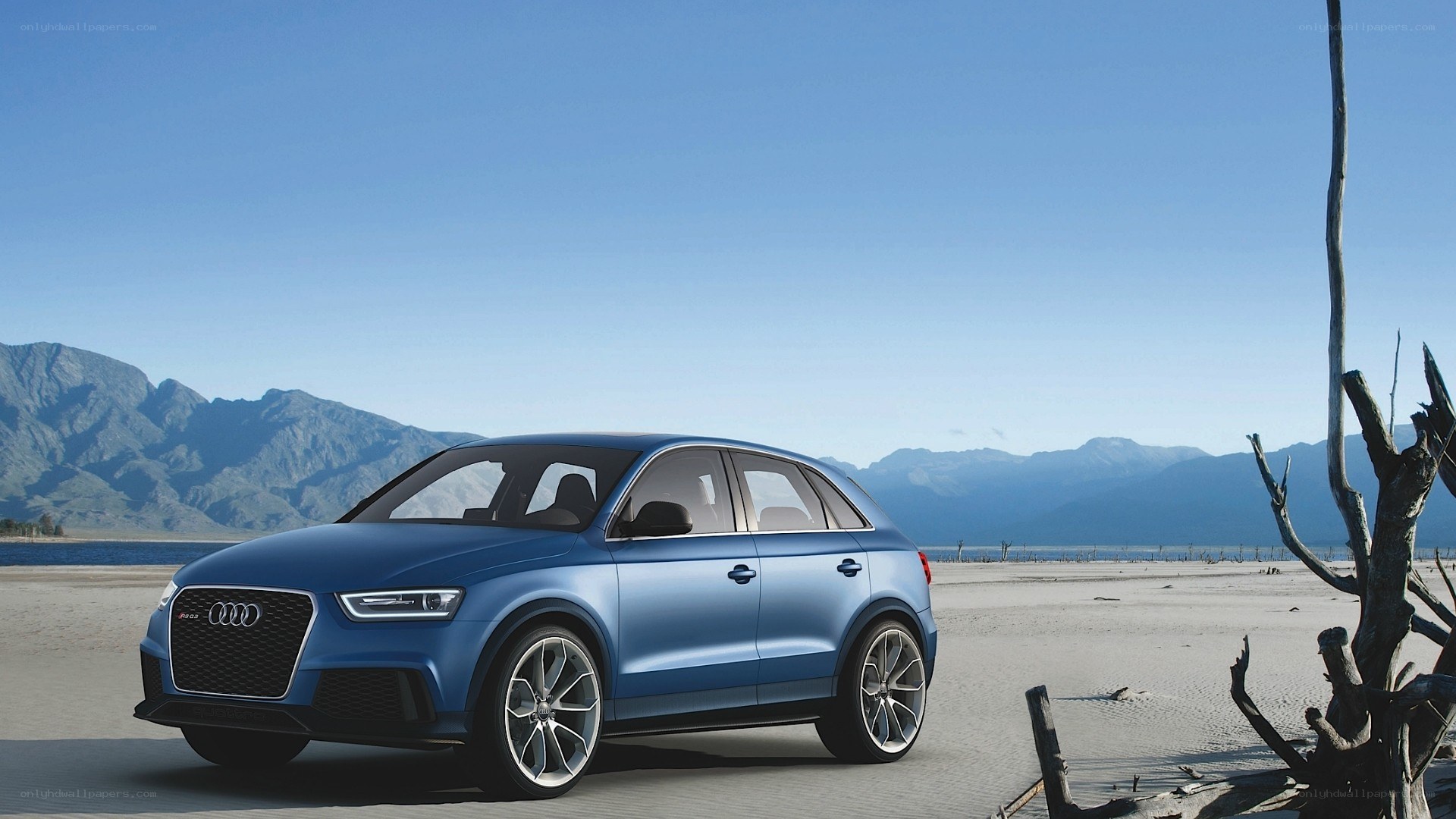 Blue Audi SUV in desert landscape