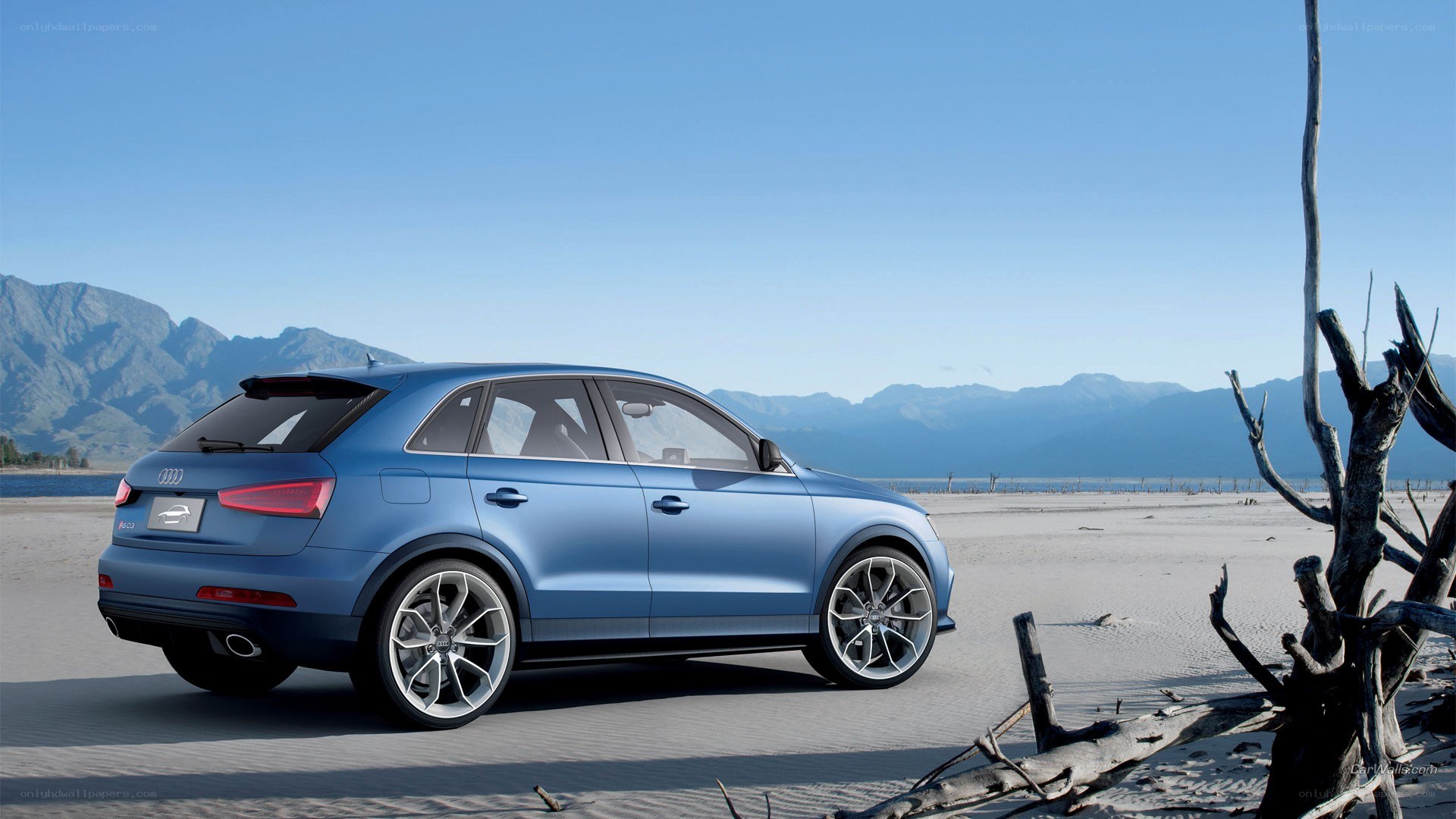Blue Audi SUV on a beach