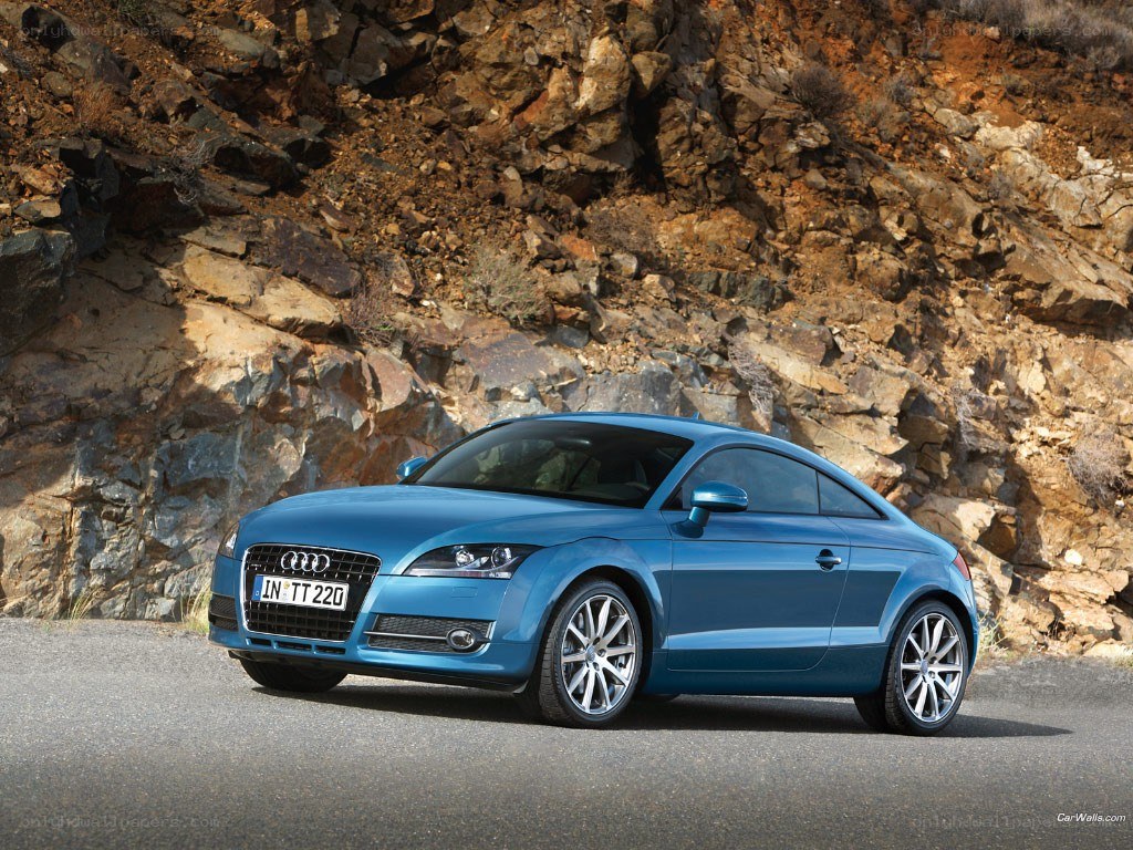 blue audi tt coupe on road