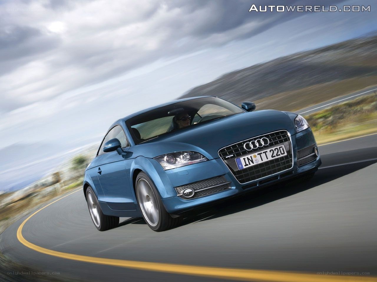 Blue Audi TT in motion