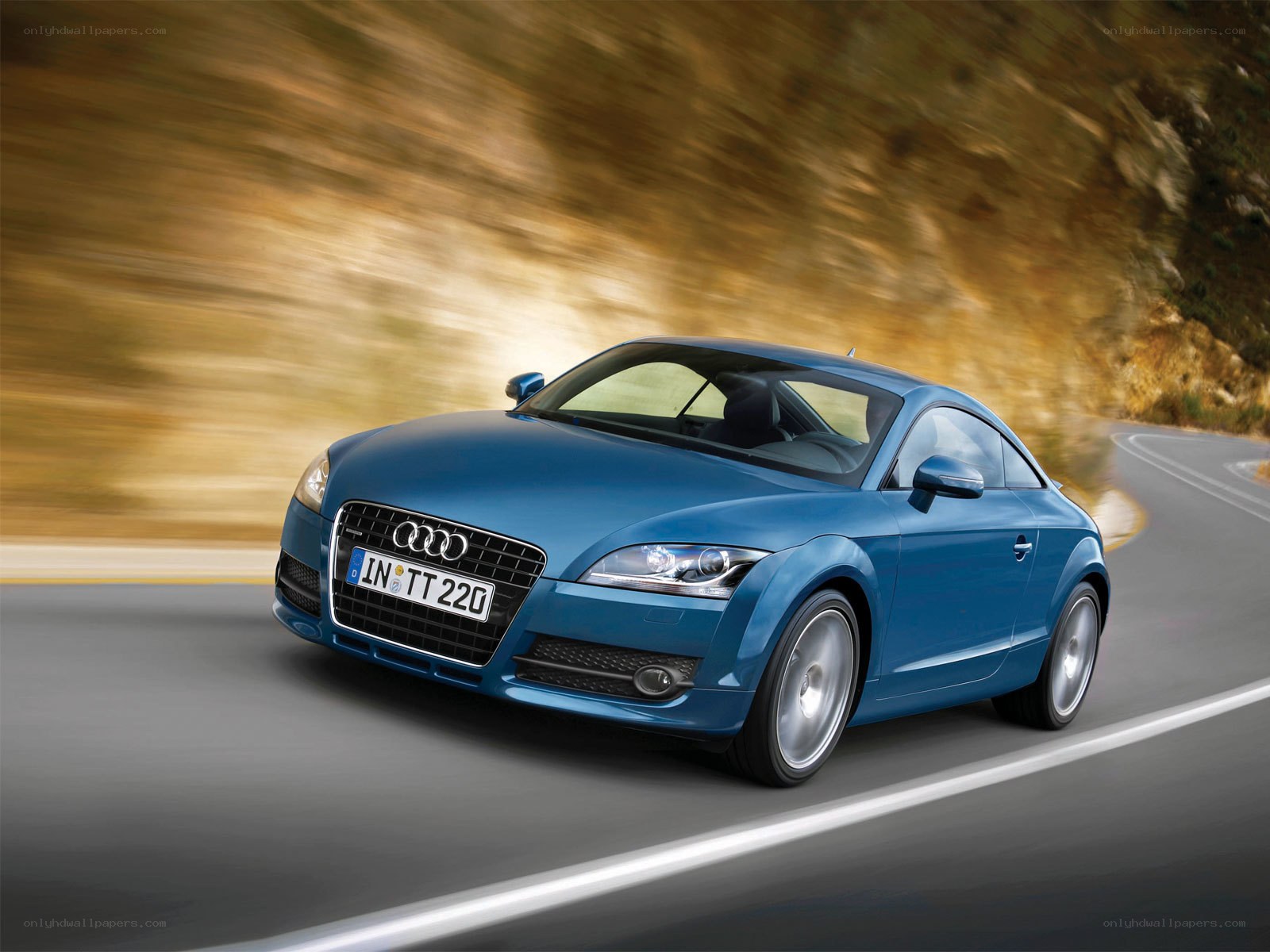 Blue Audi TT in motion