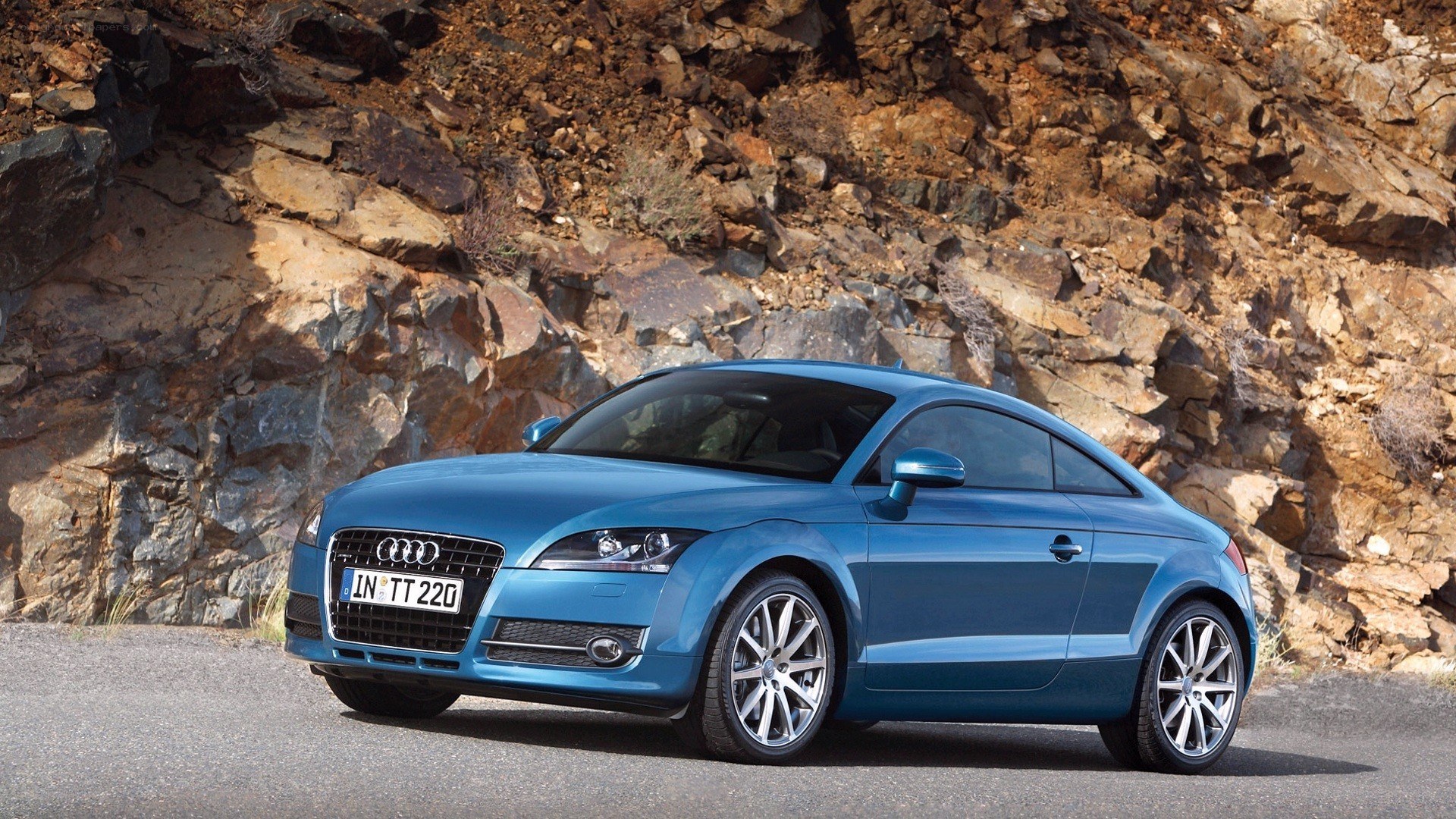Blue Audi TT on a mountain road