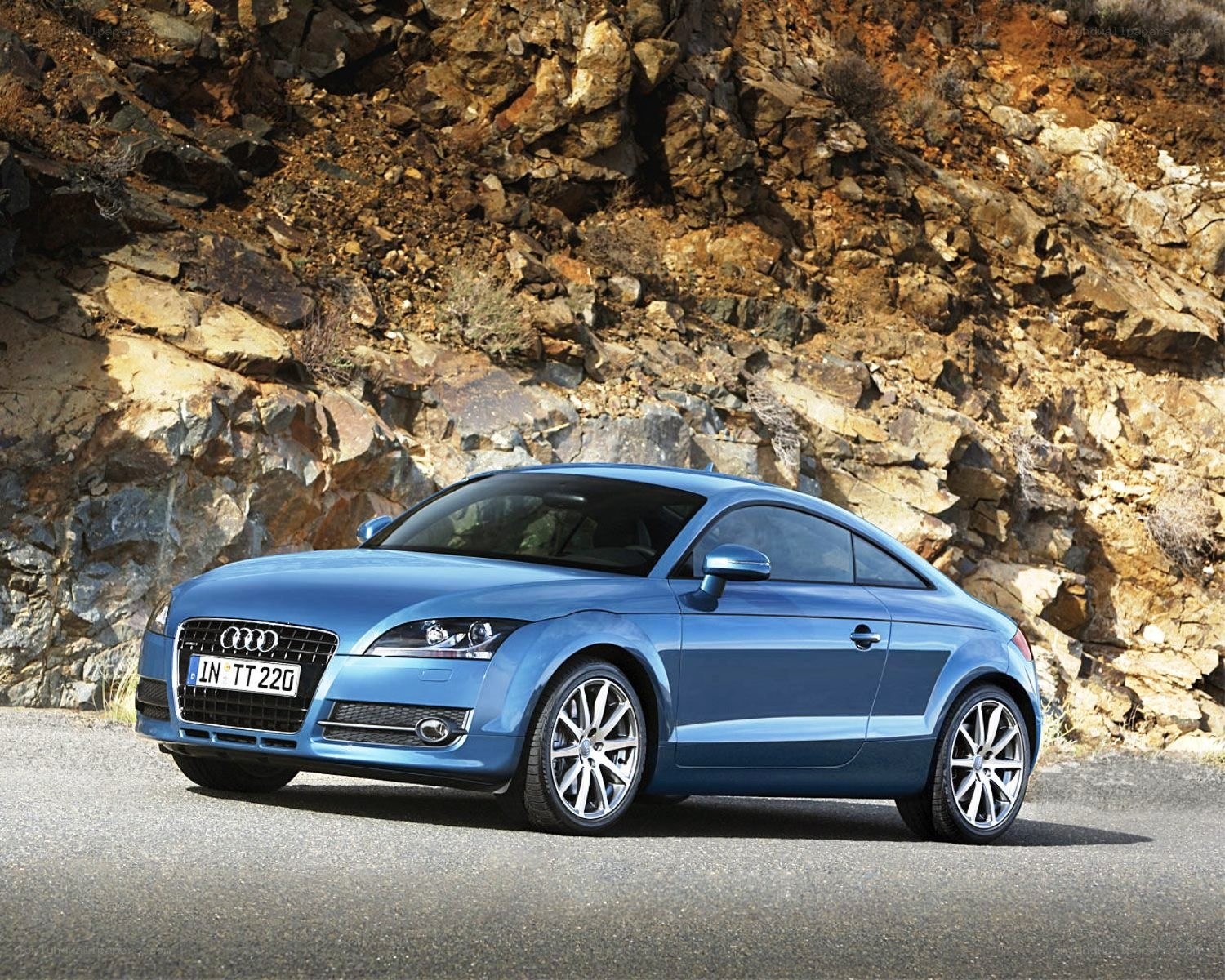 Blue Audi TT on a mountain road