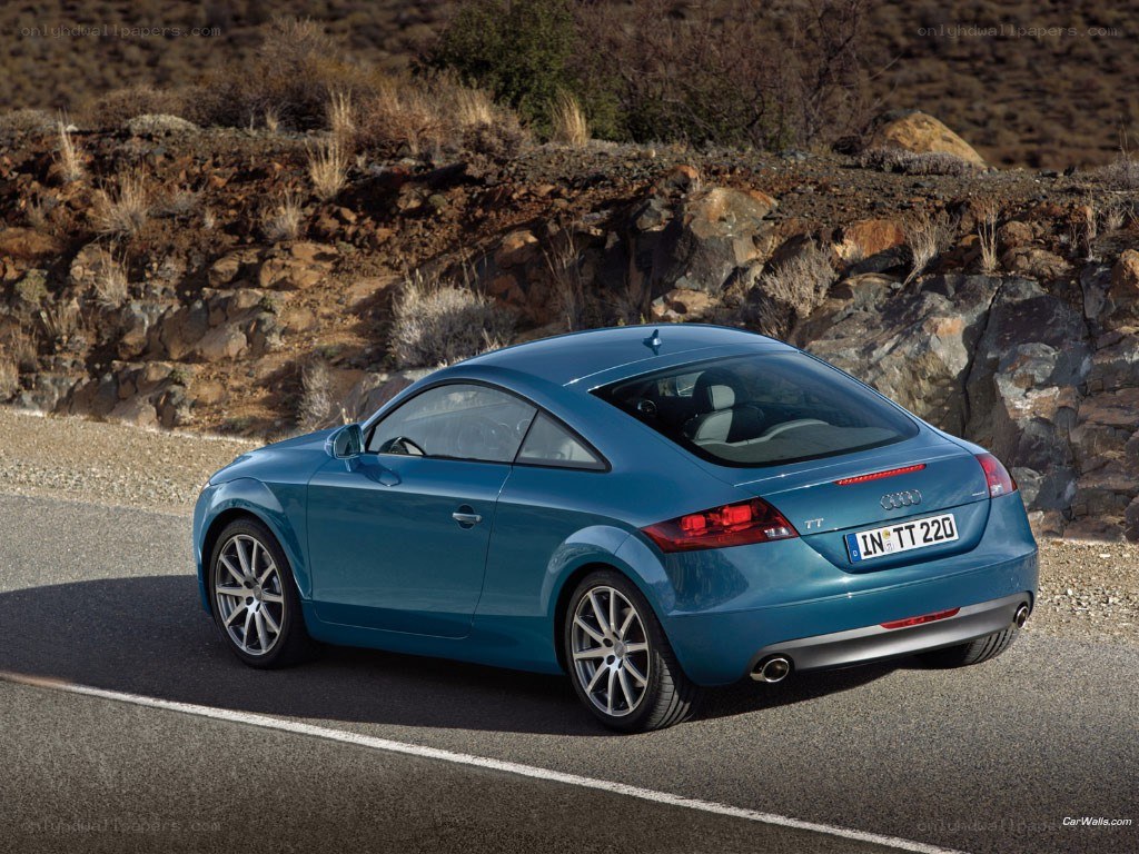 blue audi tt on a road