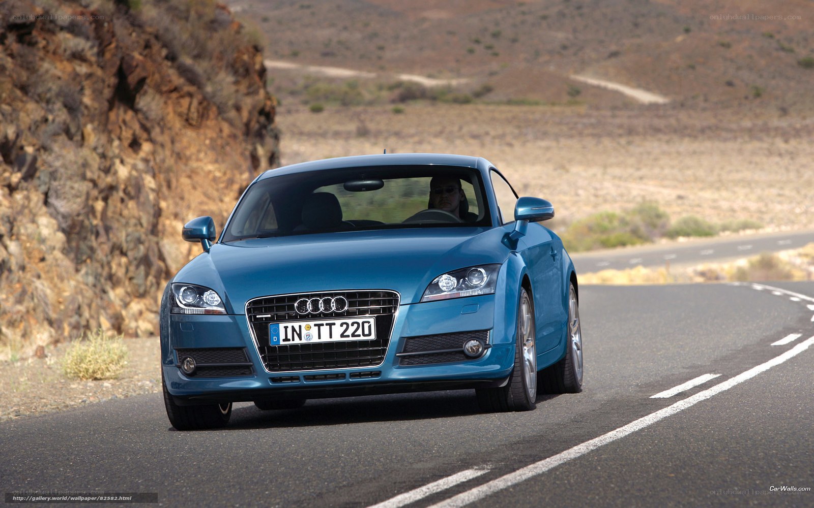 blue audi tt on winding road