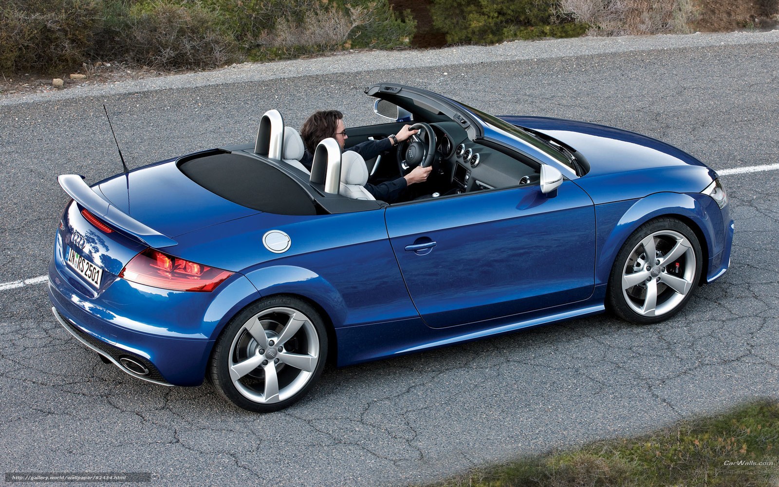Blue Audi TT Roadster driving