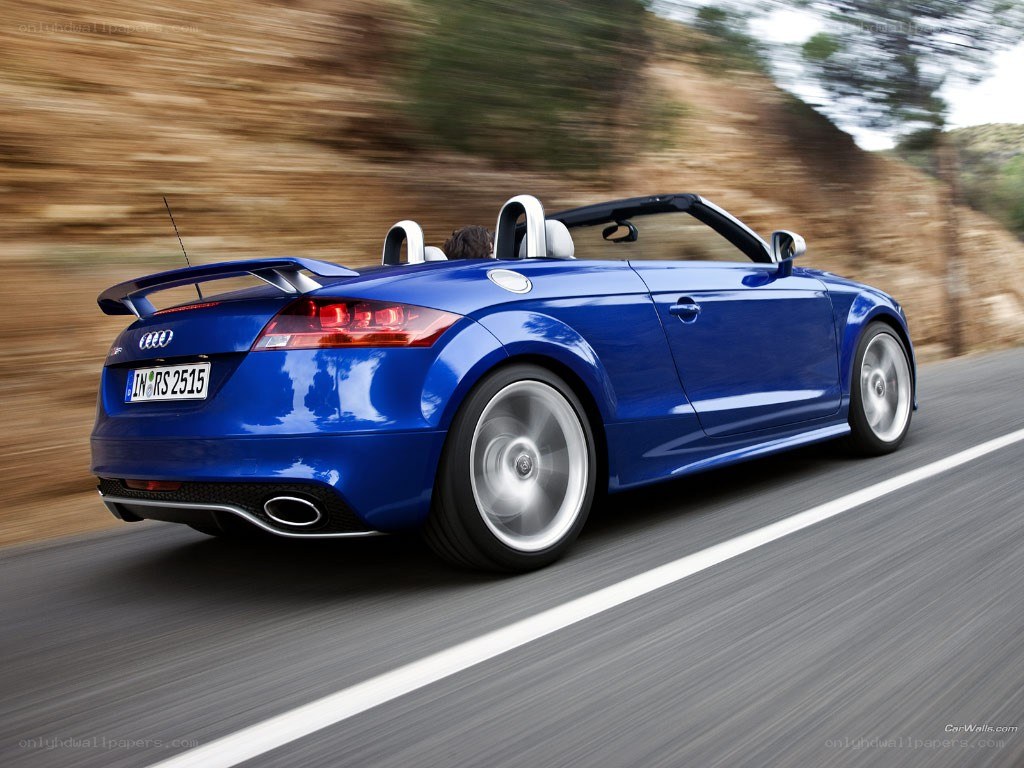 blue audi tt roadster in motion