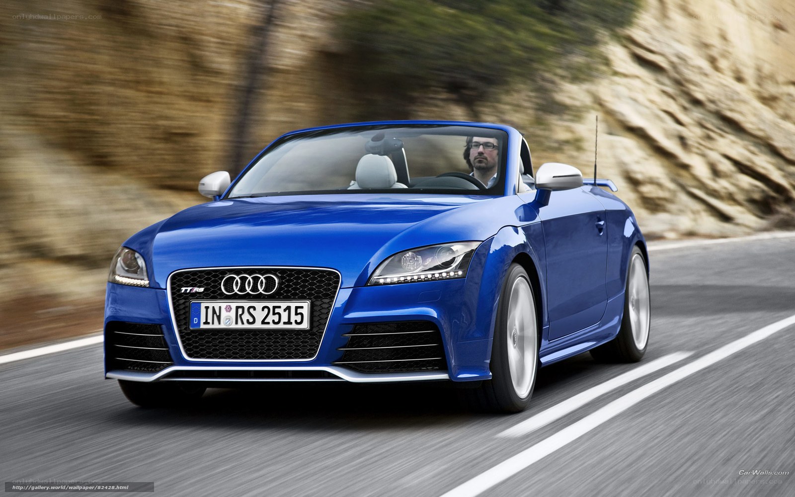 Blue Audi TT RS convertible driving