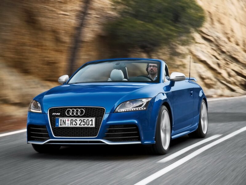Blue Audi TT RS convertible in motion