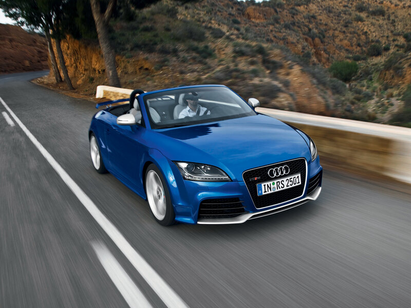 Blue Audi TT RS convertible on road