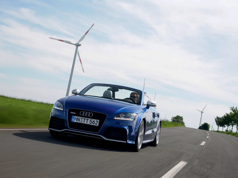 Blue Audi TT RS convertible on road