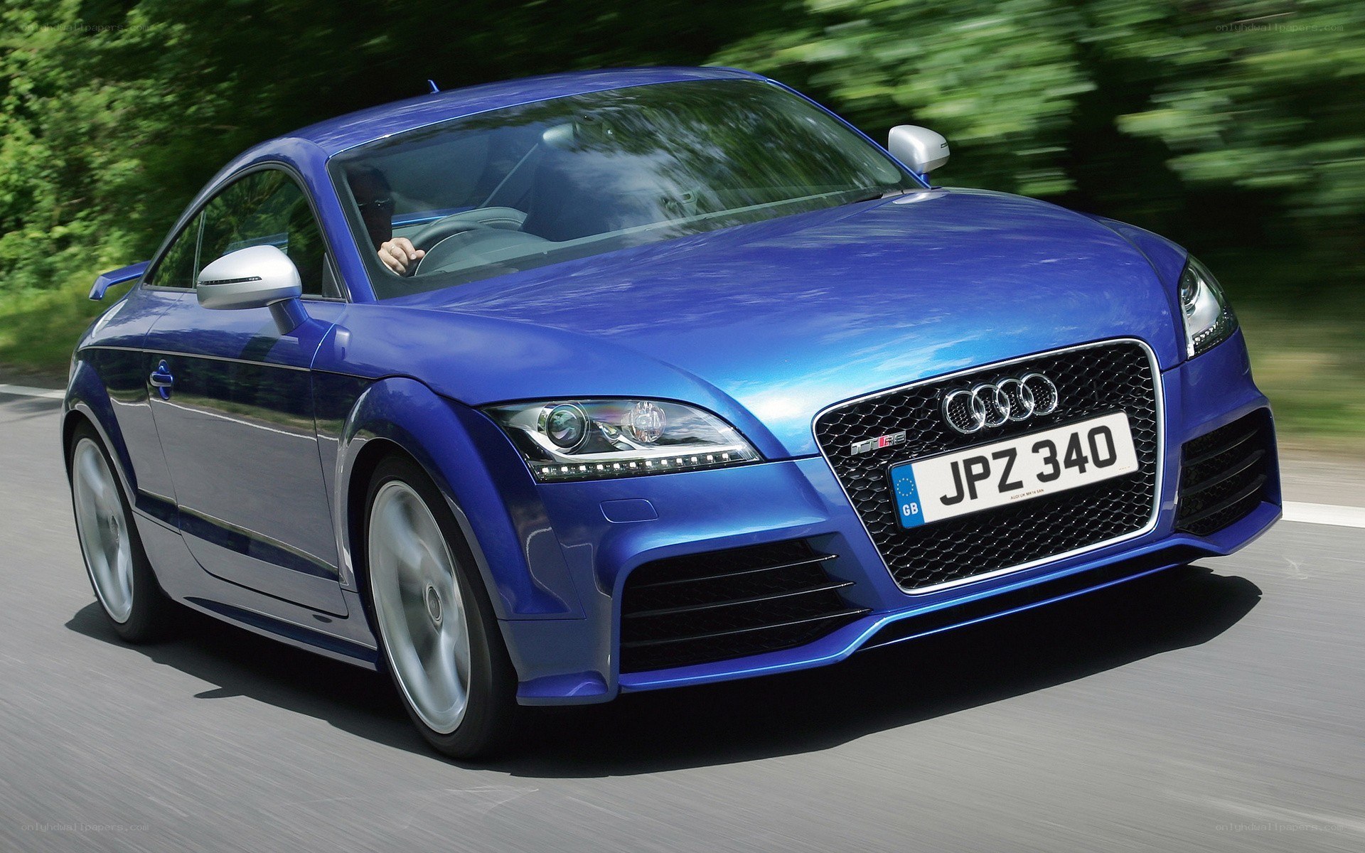Blue Audi TT RS in motion