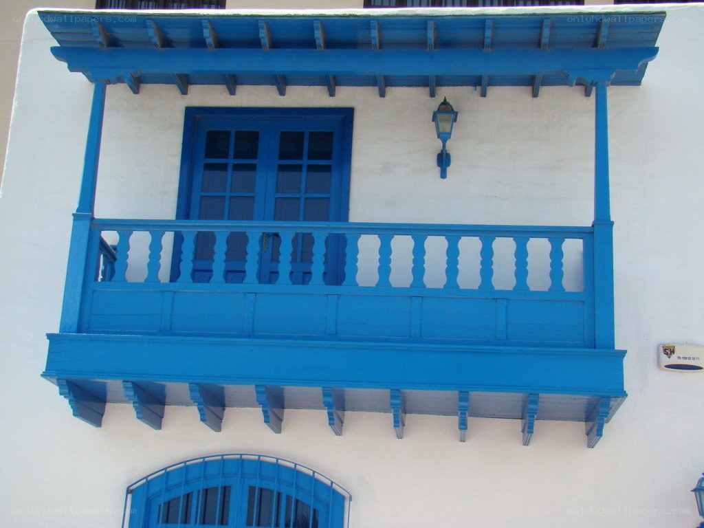 blue balcony on white building