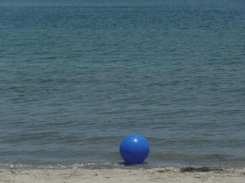 Blue ball on the beach